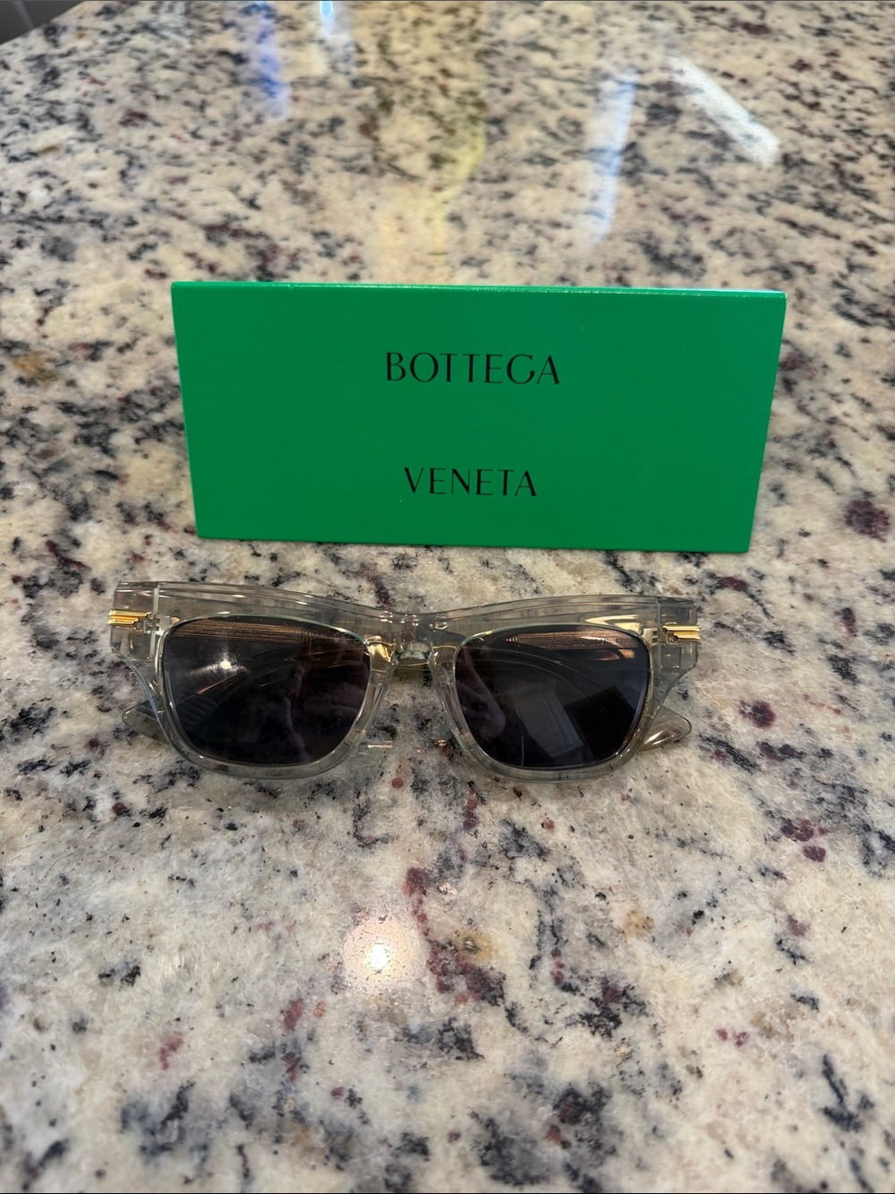 Bottega Veneta Clear Frame Sunglasses with Dark Smoke Lenses and Gold Accents